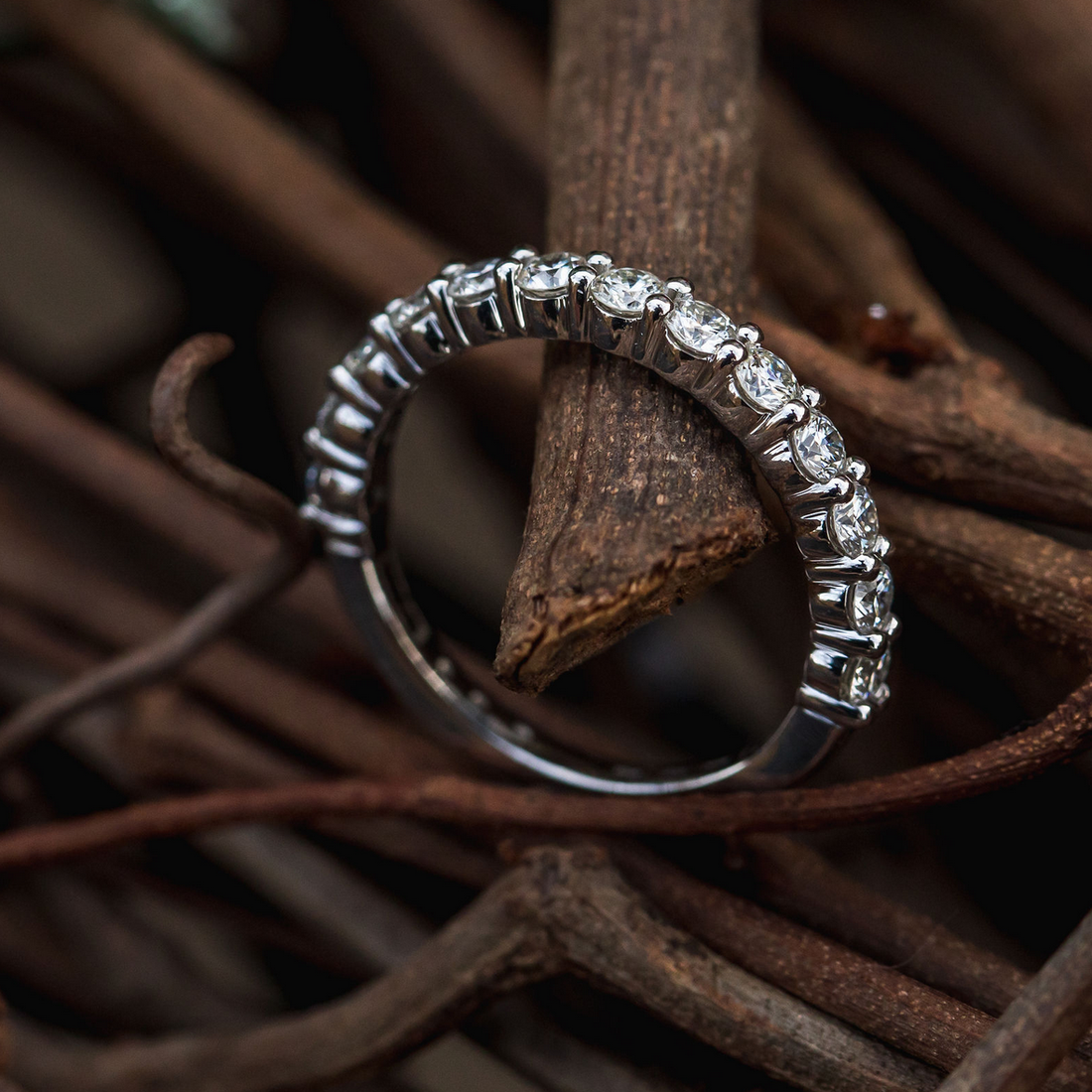 Close-up shot of a custom gold ring underbezel showing a precisely polished lip protecting the diamond girdle.