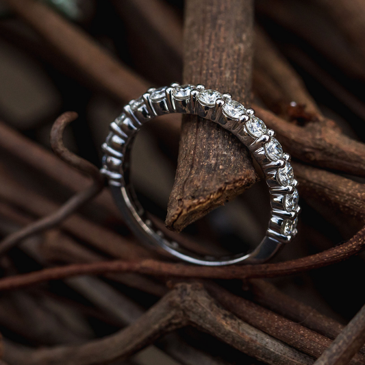Close-up shot of a custom gold ring underbezel showing a precisely polished lip protecting the diamond girdle.