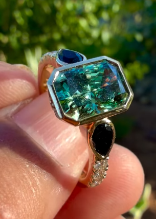 green diamond ring with onyx accents