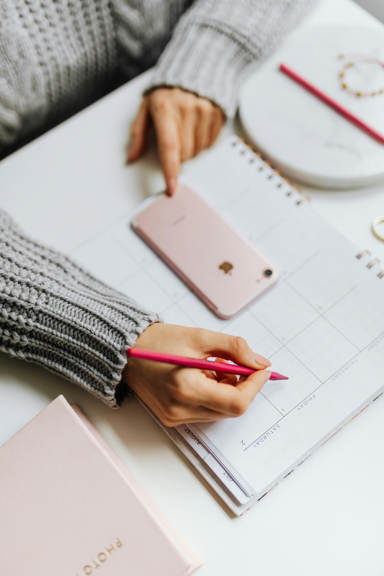 a woman looking at her calendar
